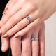 Pictured are hands with Evangelion wedding rings.